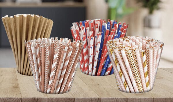 Replay Products | Eco-friendly Paper Straws in a variety of colors on a wooden table.